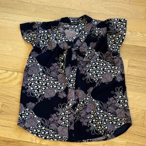 Women’s tie neck blouse.  Paisley floral.  Pit to pit measurement is 21”.